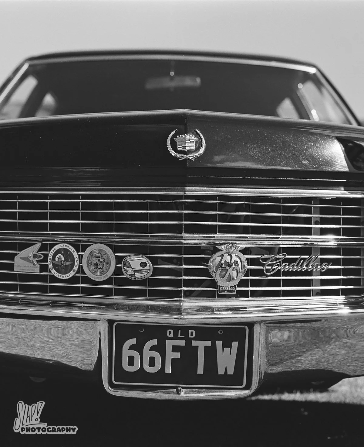 Black Cadillac Fleetwood Grille with Badges in Black and White