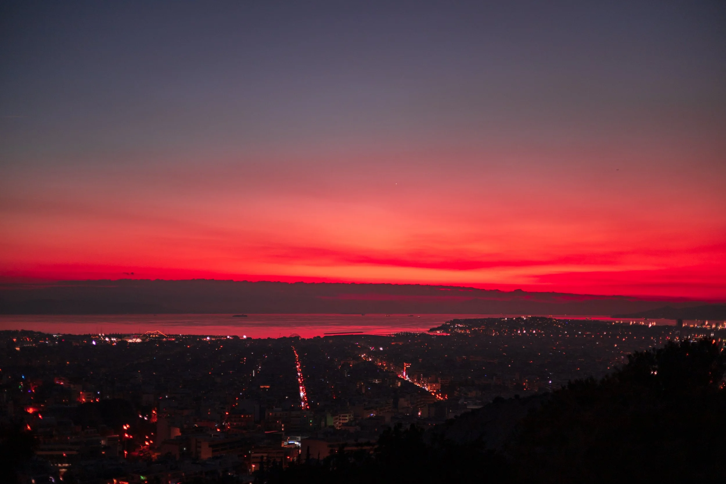 Intense blue hour hues, NYE, Athens 2022.
Looking out from Filopappou hill towards the port of Piraeus.
