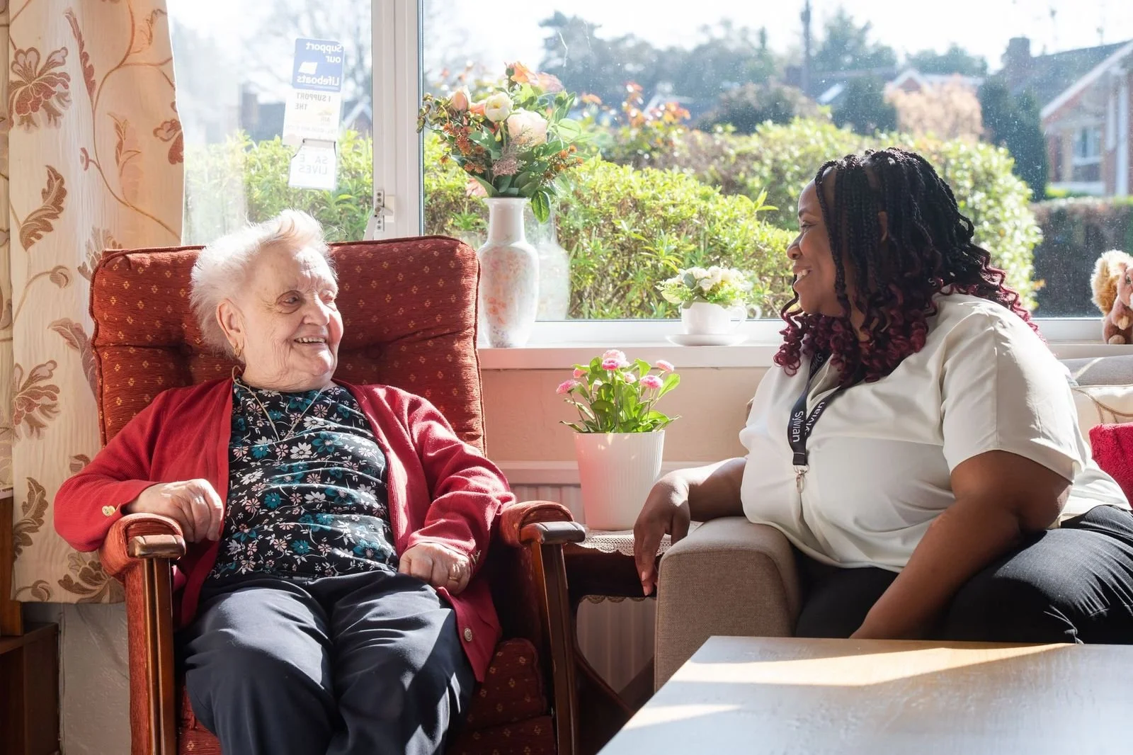 Sylvian care home care carer smiling with elderly client