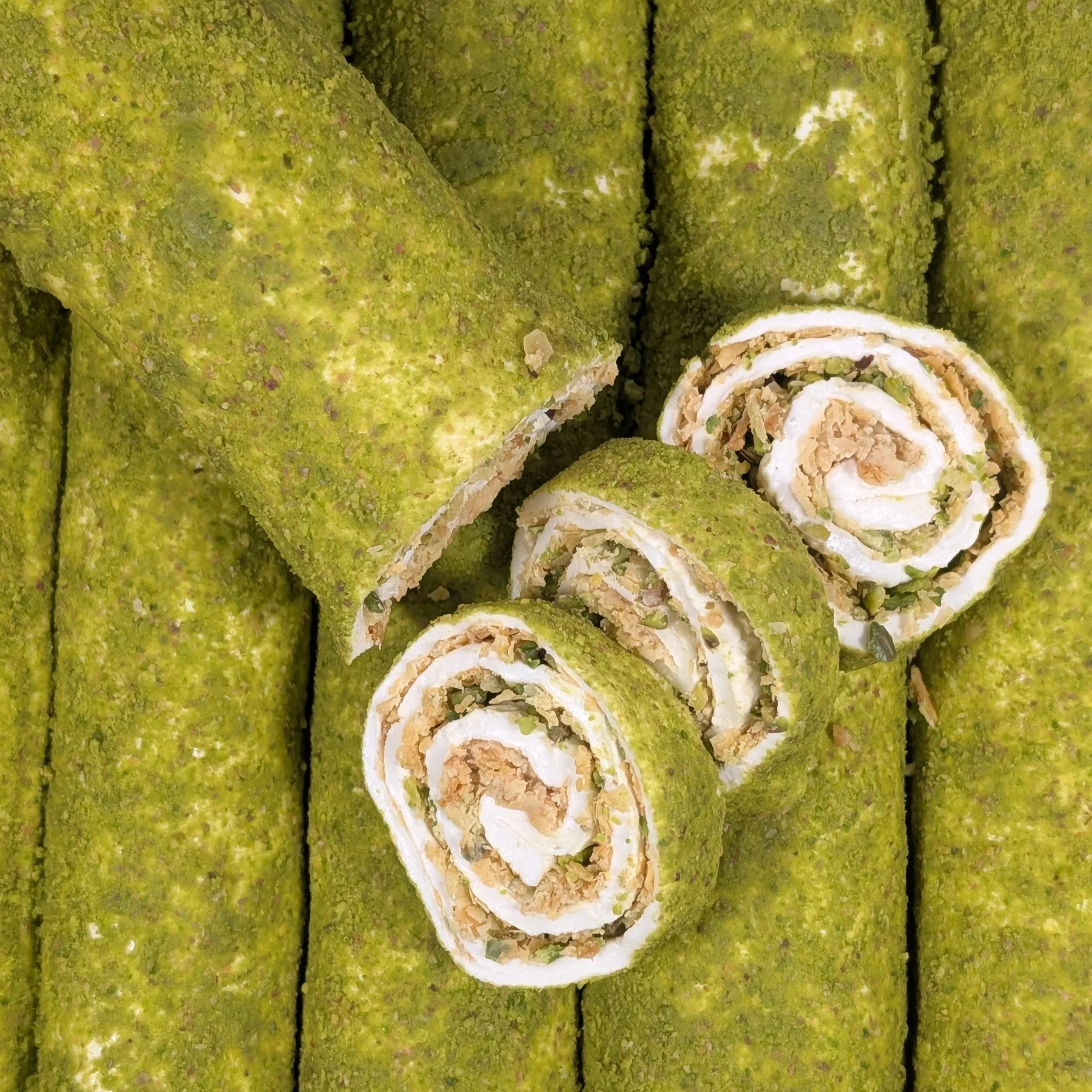 The flaky, buttery texture of baklava crumbs within our premium Turkish Delight.