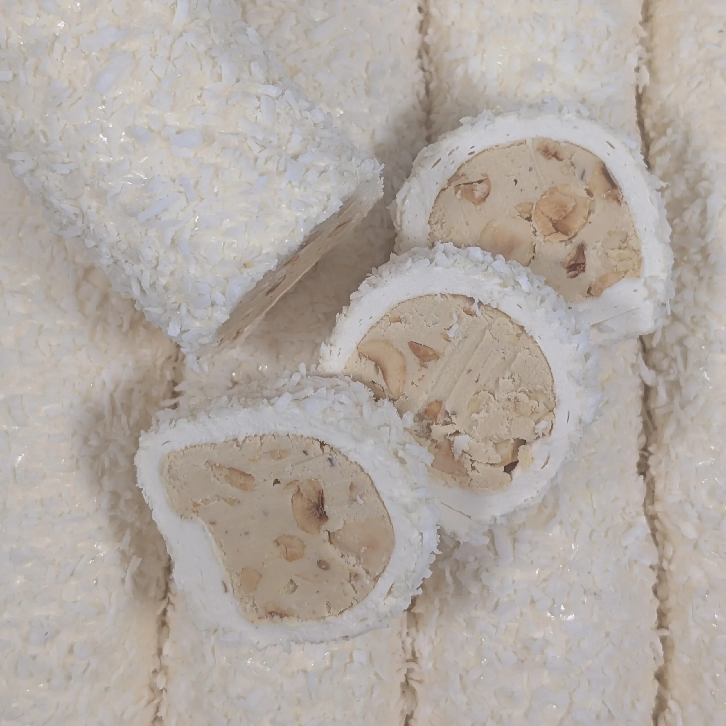 Detail of the delicate coconut flakes and smooth cream center of the Raffaela Turkish Delight.