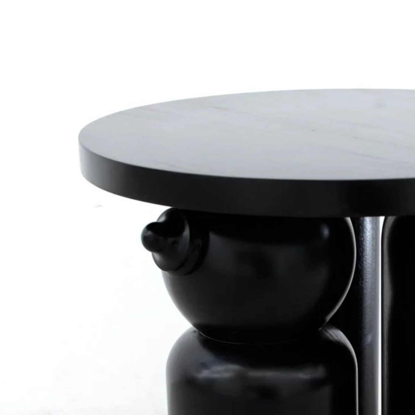 Close up of 'Mammy'. A handcarved stool conceptualised by artist Simone Brewster. The 'Mammy' is a scupltural furniture piece that draws on historical decorative objects, colonial furniture and representations of Black women in art history