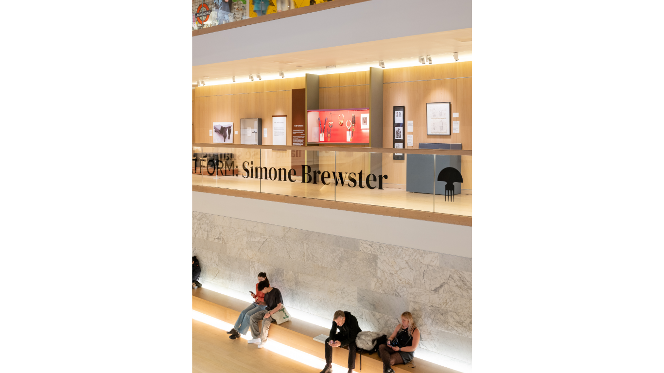 PLATFORM: Simone Brewster at the Design Museum (2026) - image of people in the Design Museum where Simone Brewster is featured with a solo exhibition. View of the Design Museum balcony and her jewellery, sculptural furniture and exhibition text in bg