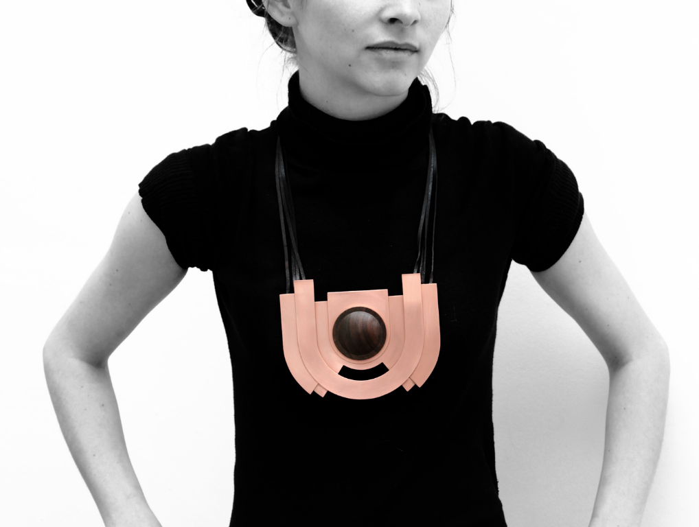 A woman models one of the necklaces crafted by Simone Brewster for the Ebony Revolution collection
