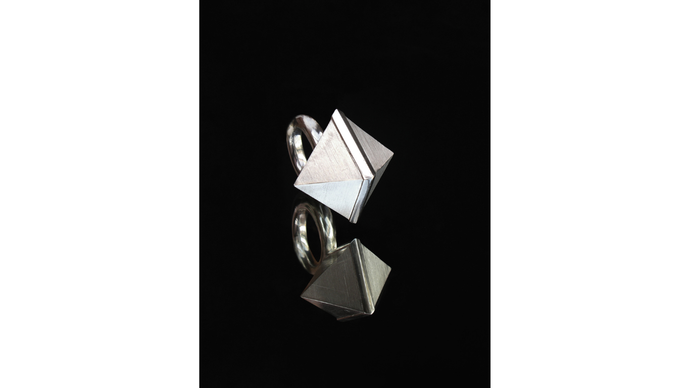 Close up silver cuboid shaped ring design by Simone Brewster