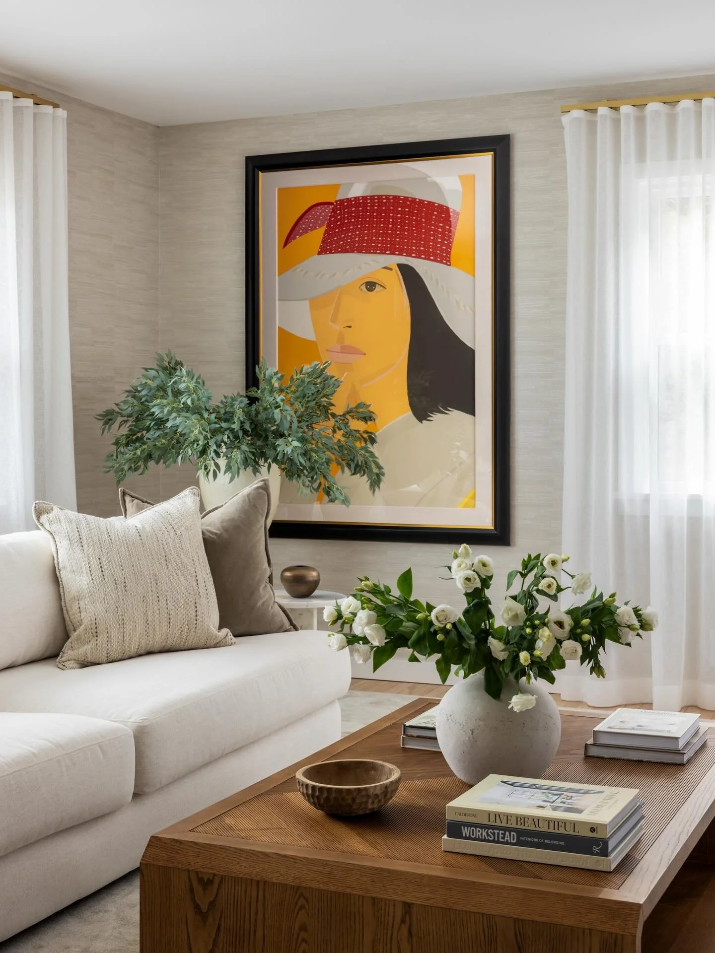 This living room is one of those spaces where everything just came together so naturally. We love how our clients&rsquo; art complements the room so beautifully, adding personality without overpowering the design. By layering in warm woods, soft text