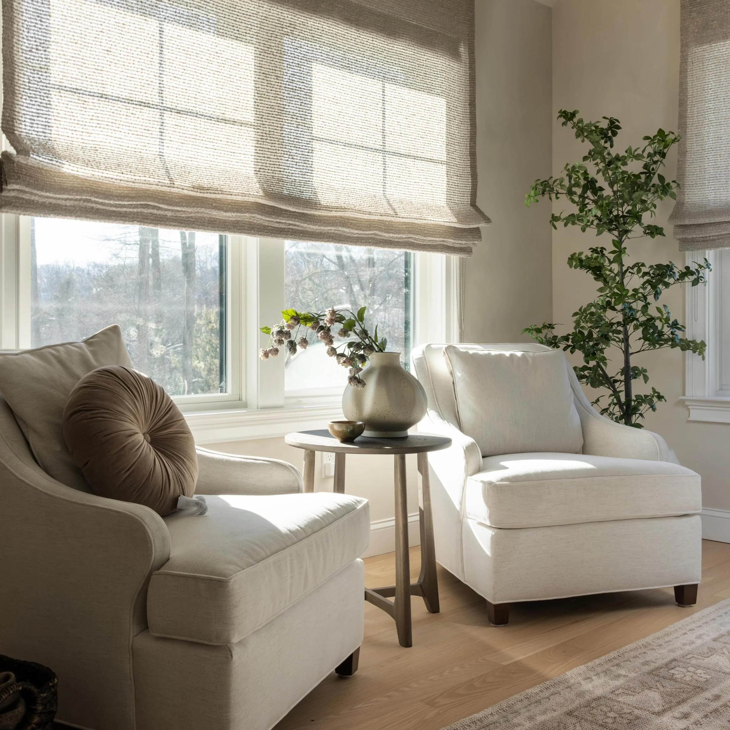 One of the most overlooked opportunities in a home is the room without a purpose.

This space was once home to a Peloton and little else. With a the right intention, it became the favorite seat in the house.

Cozy chairs, woven roman shades, and noth