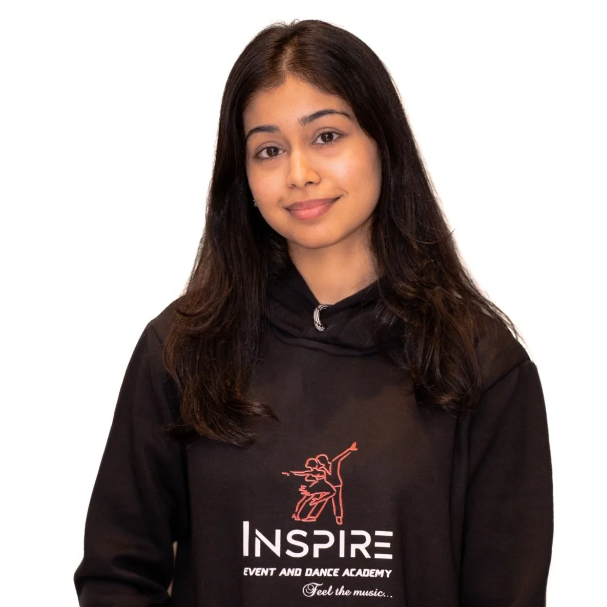 Young woman with long dark hair wearing a black hoodie with red and white text and graphic, smiling lightly against a white background.