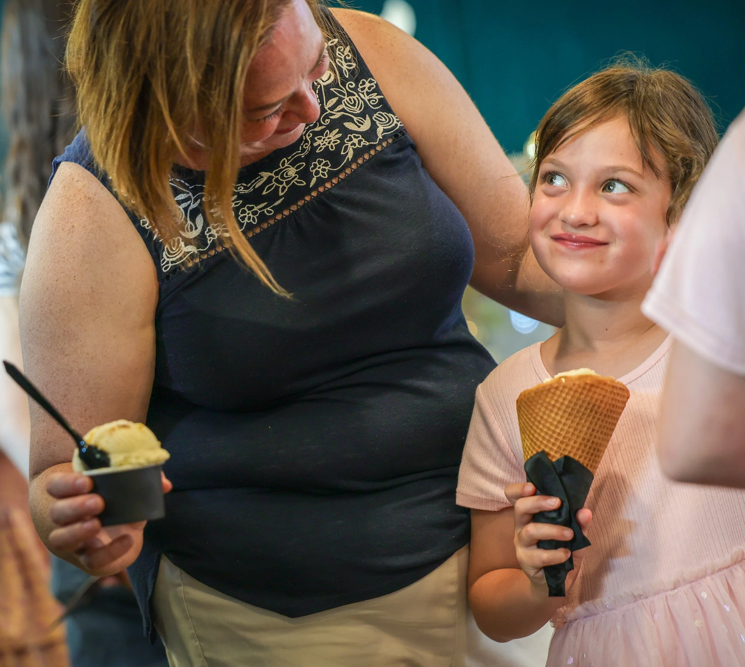 Mother and daughter enjoy an ice cream cone in downtown Toledo Ohio at Swanky Scoops grand opening. Photo credit Phillip A. Kaplan The Blade
