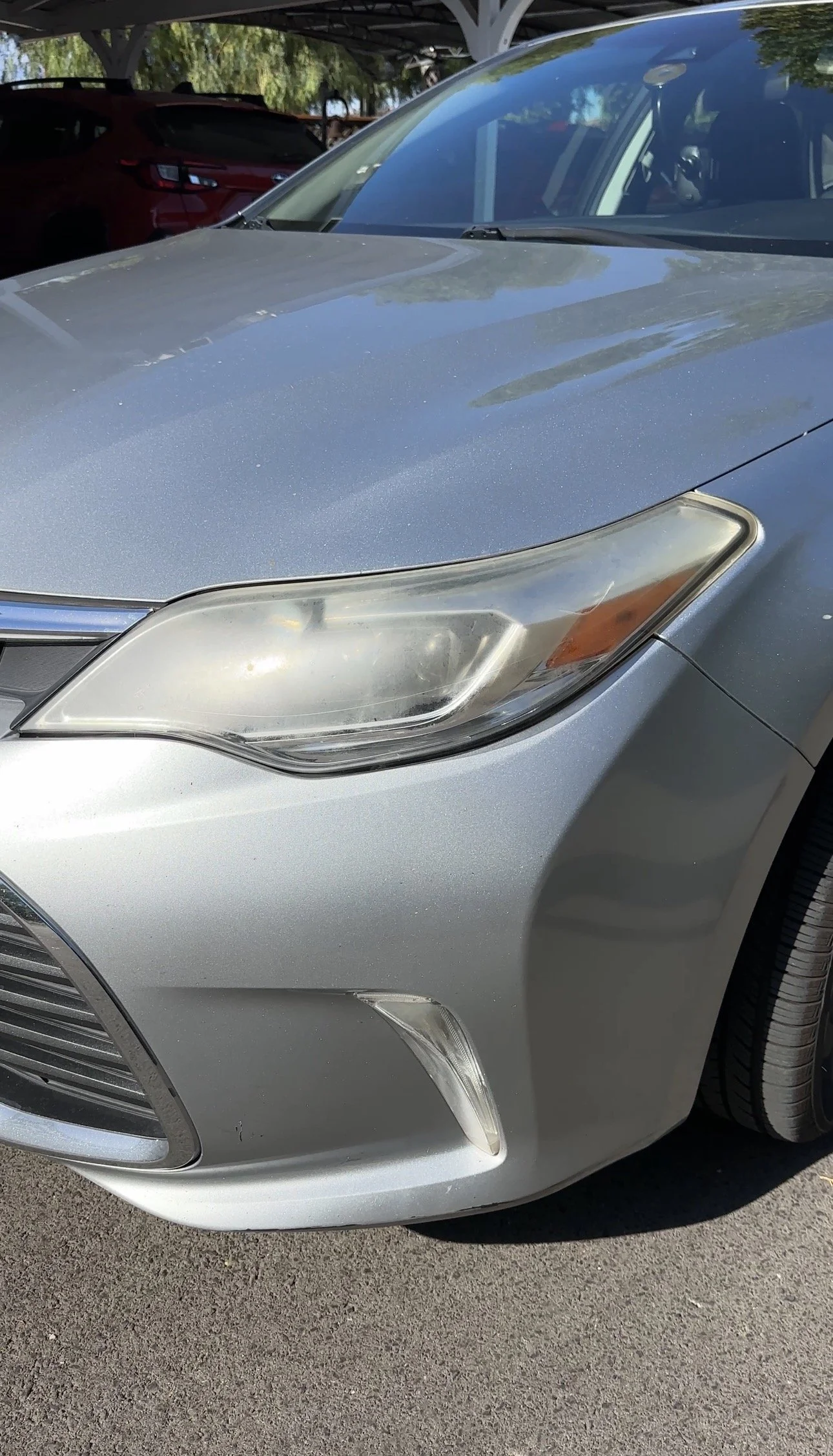 Headlight lens with a cloudy surface before restoration.