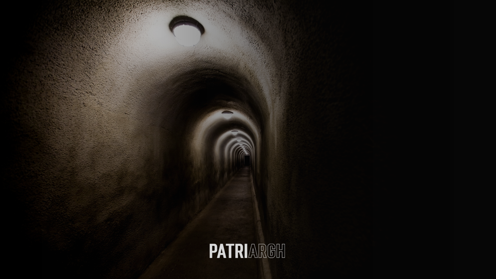 Dark tunnel with repeating lights suggesting the narrowing choices within coercive control systems.