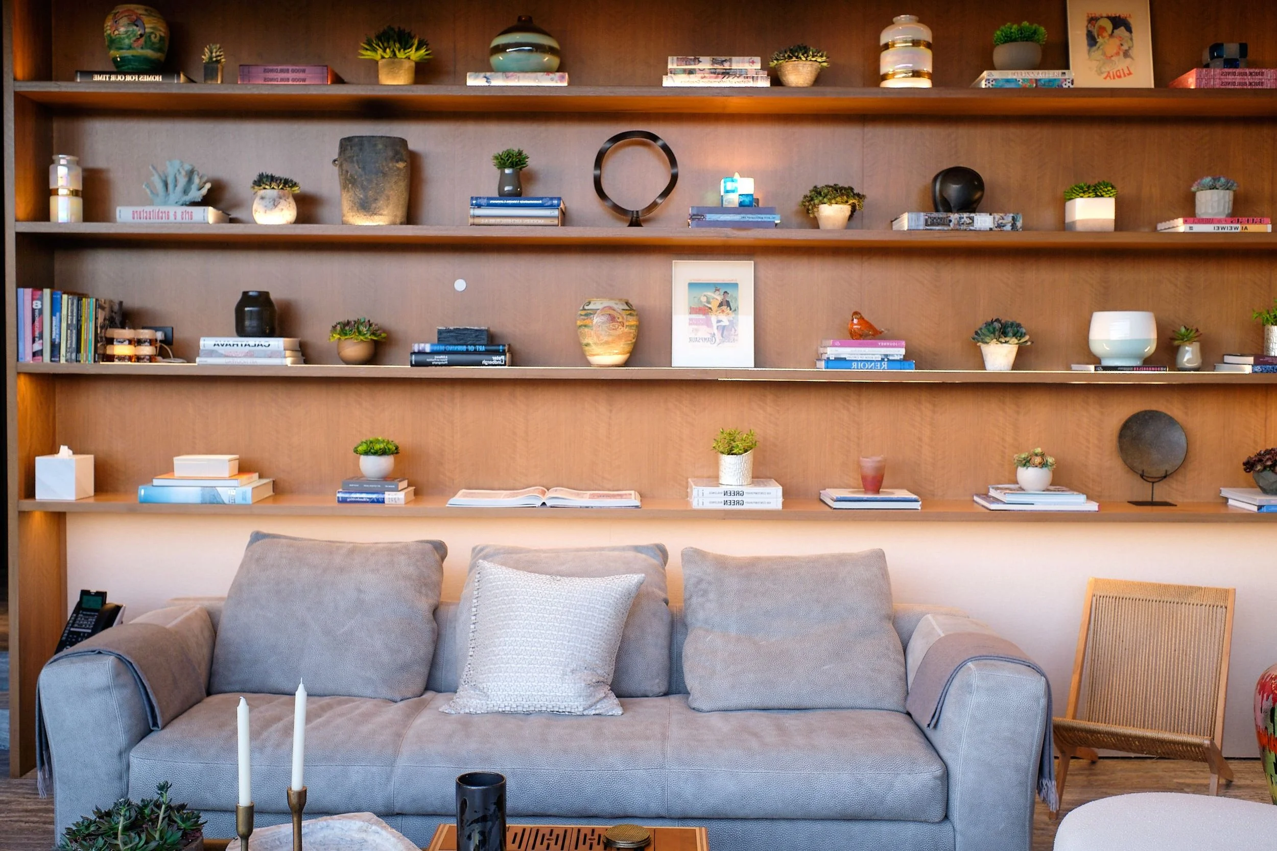 Minimalist living room with a Josh Nano microphone seamlessly integrated for natural voice-controlled home automation.