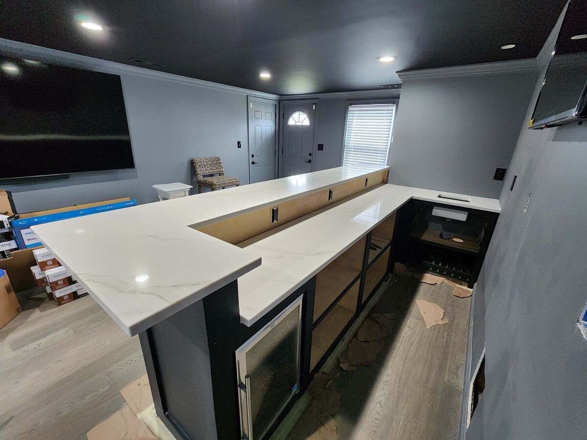TV behind and in front of the bar with our countertops = awesome man cave ⛰️