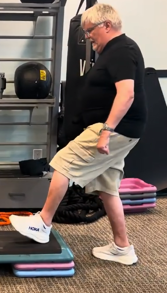senior man performing strength and mobility exercises