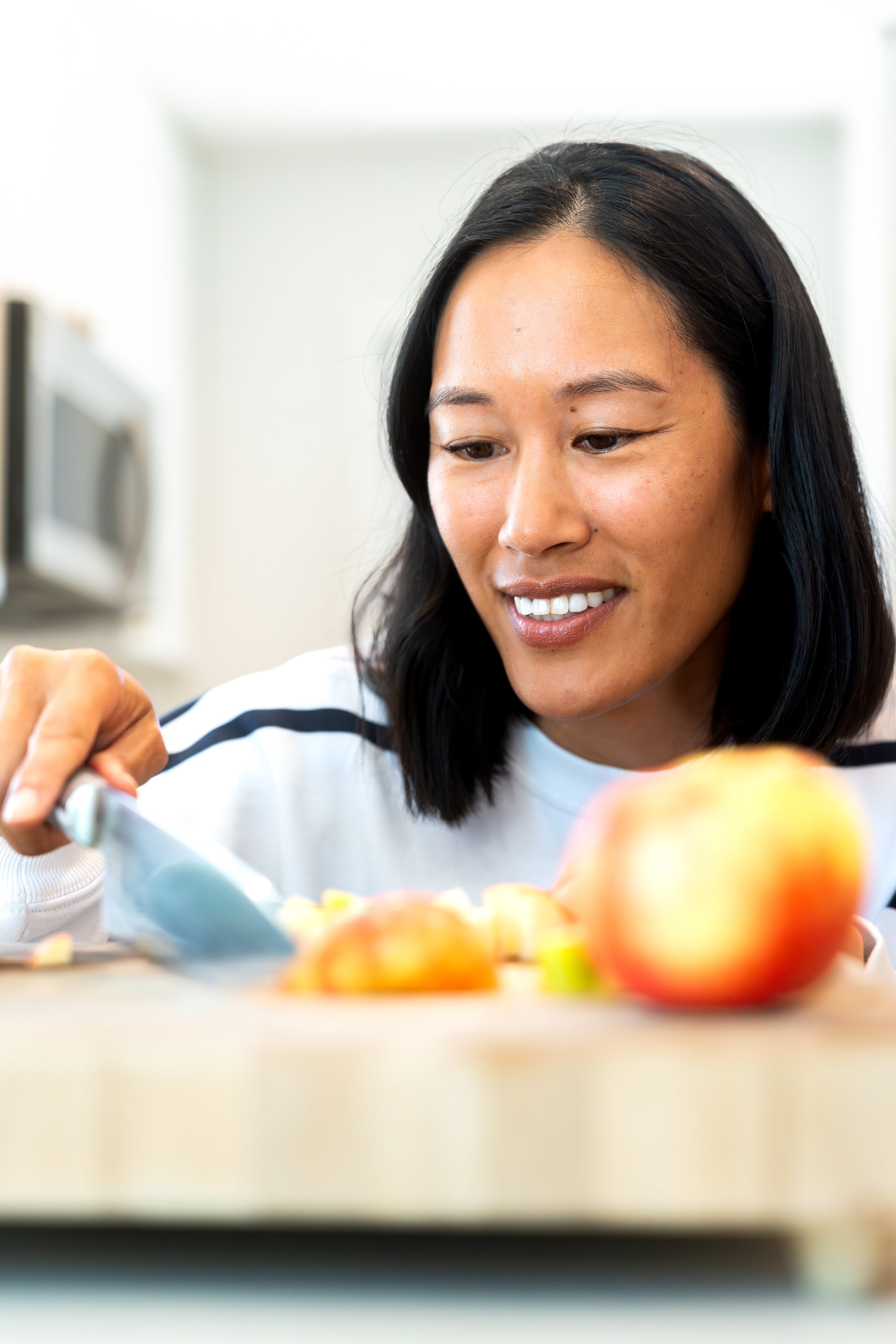 Liz Hall preparing nutritious meals, inspiring confidence in healthy living