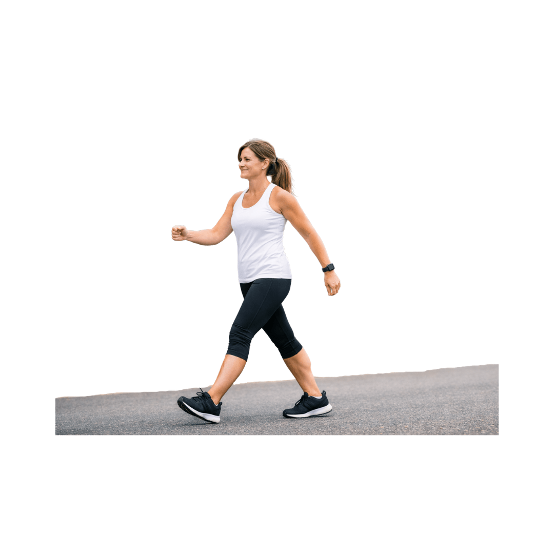 Woman walking outdoors in athletic wear, symbolizing a healthy lifestyle and fitness.
