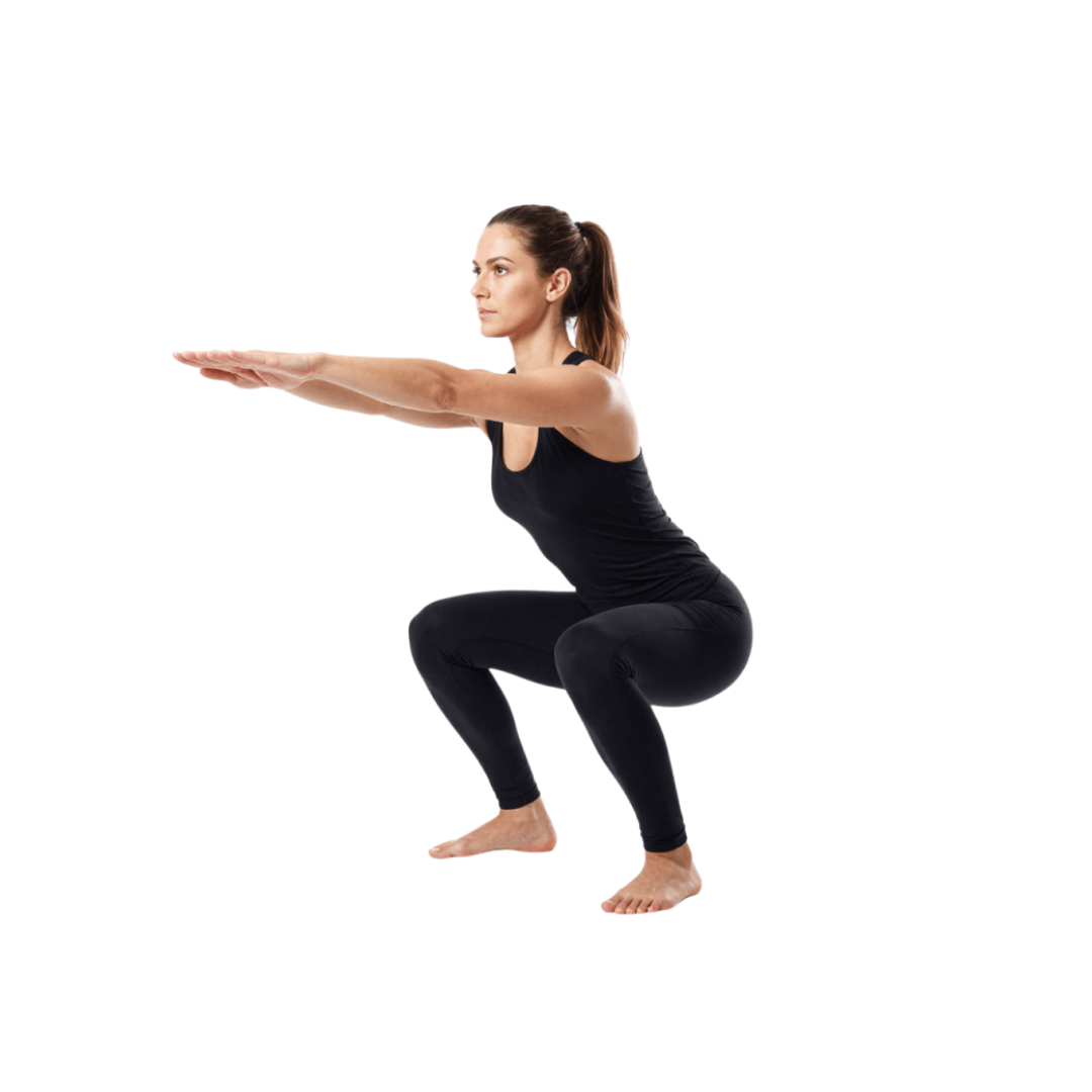 Woman in a deep squat hold, barefoot on a white background, wearing black athletic wear, showing hip and ankle mobility.