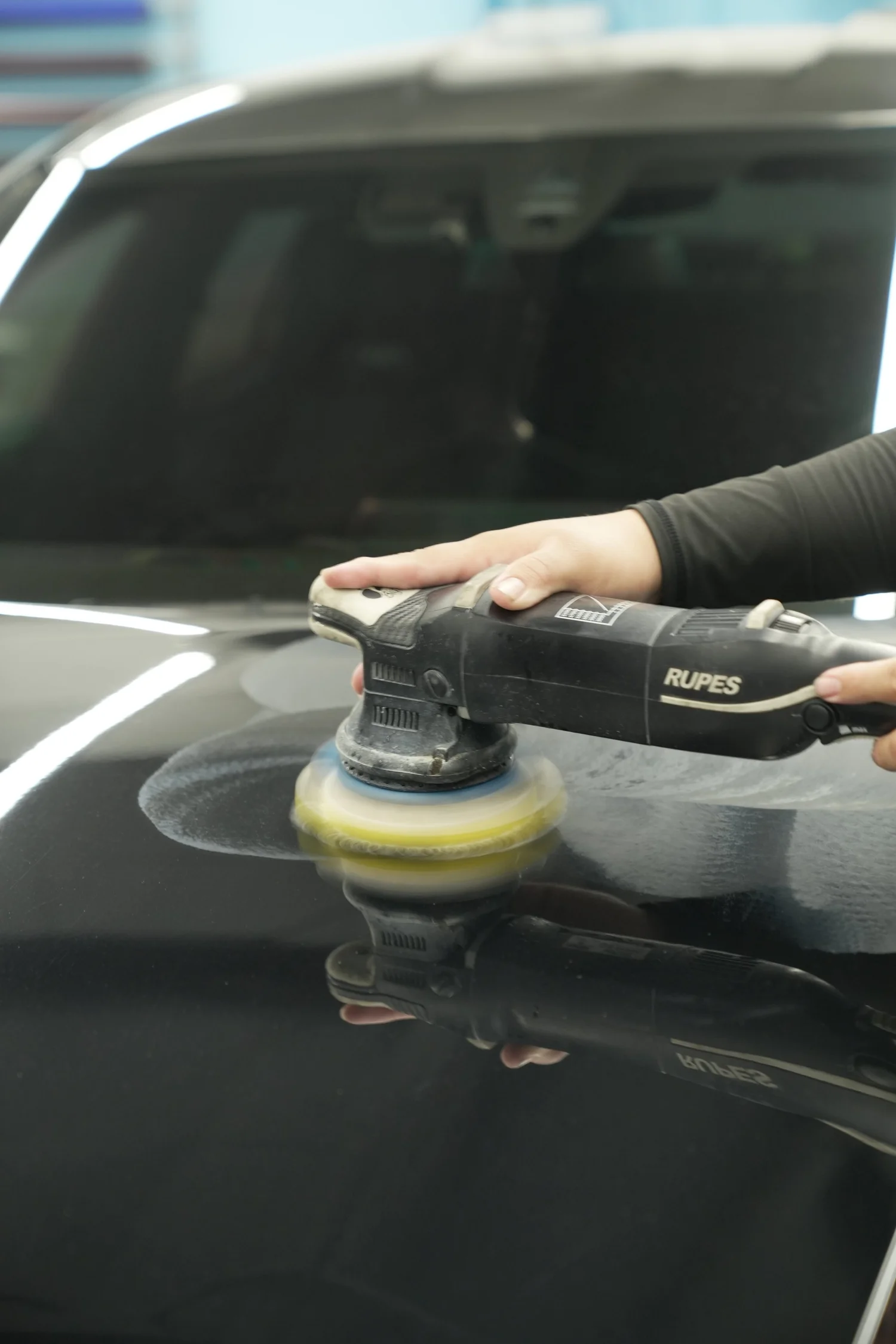 BMW M8 paint-polishing process on body panel