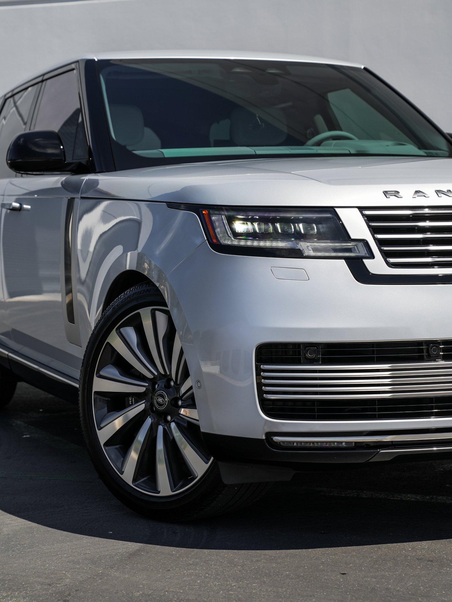 Range Rover SV passenger-side front corner and wheel detail after full exterior PPF, window tint and ceramic coating