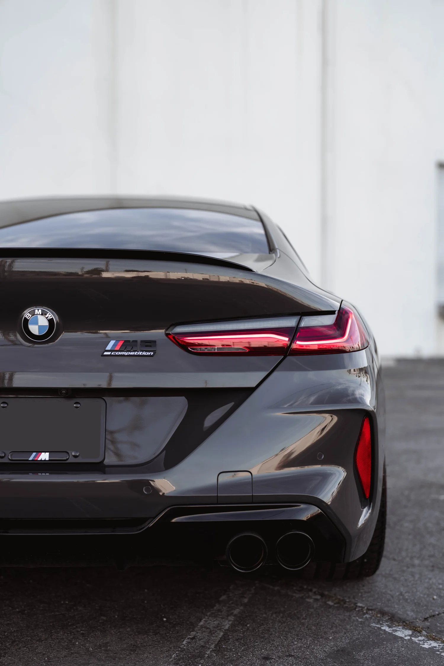 BMW M8 after Paint Protection Film (PPF), Window Tint and Ceramic Coating, rear body and taillight view