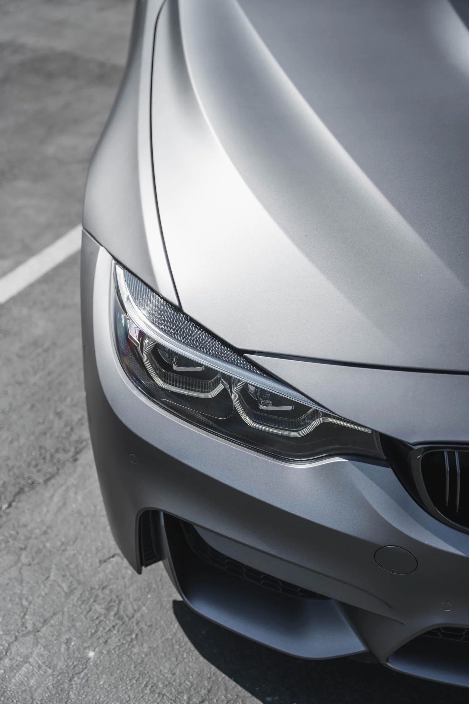 BMW M4 Matte Grey after Vinyl Wrap, front-corner view