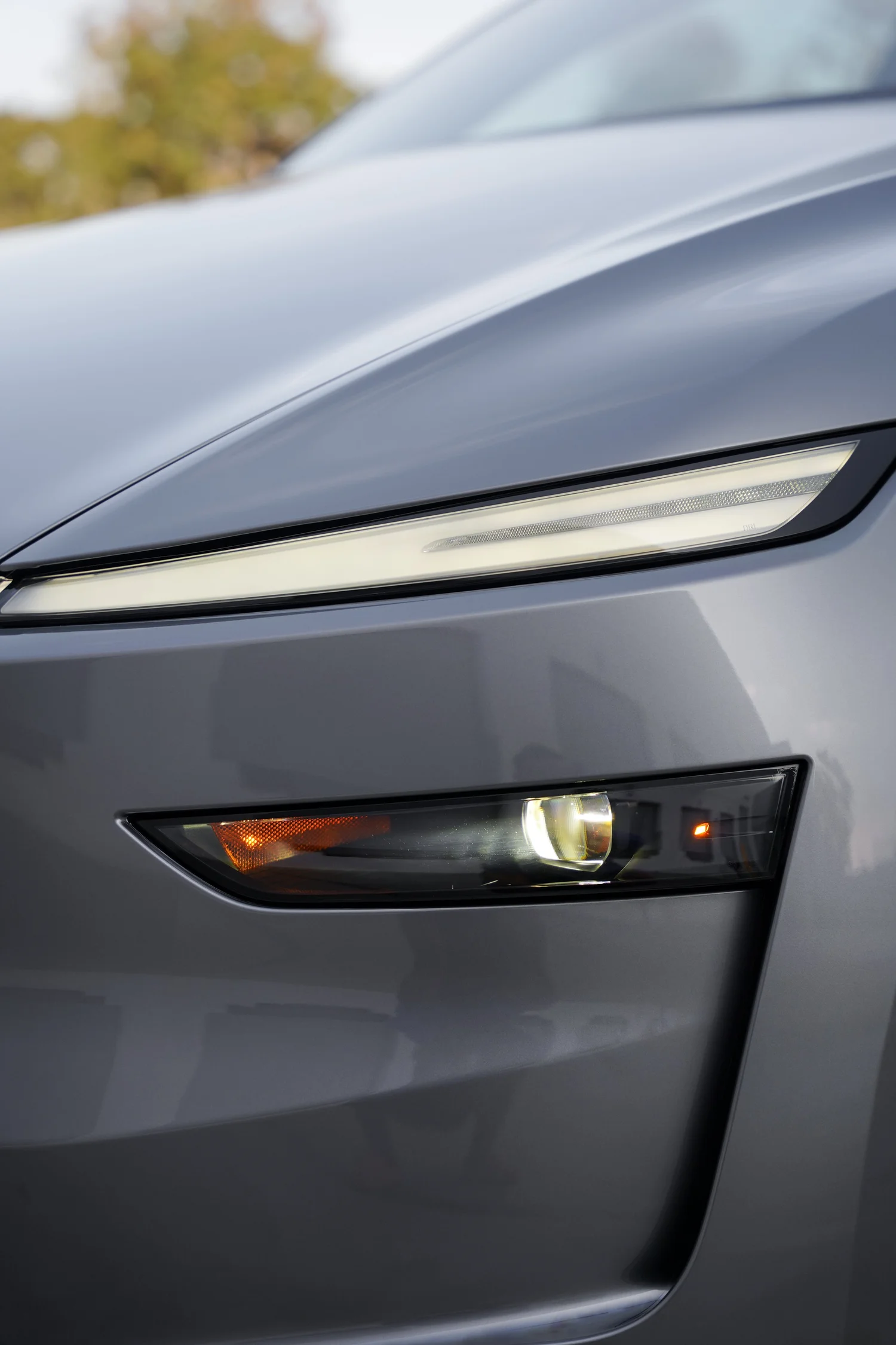 Grey Tesla Model Y after Paint Protection Film (PPF), Window Tint and Ceramic Coating, front-corner view