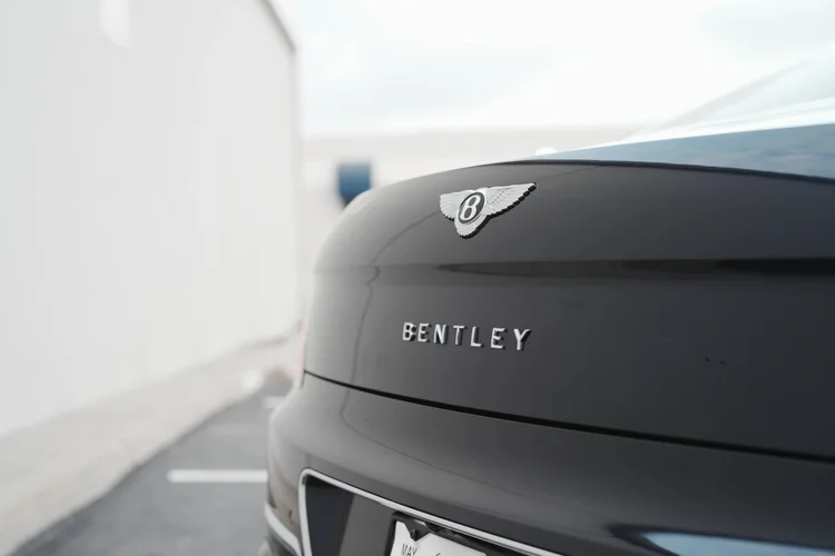 Winged Bentley trunk badge above spaced Bentley lettering.