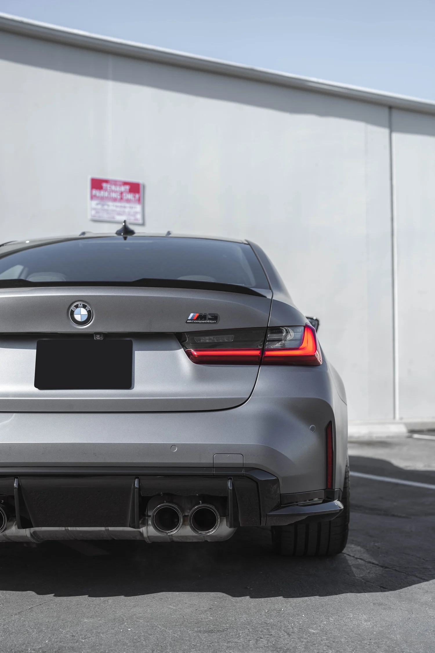 BMW M3 Matte Grey after Vinyl Wrap, low-angle rear view