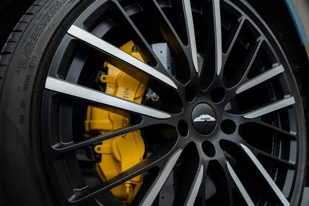 Aston Martin DBX 707 alloy wheel, tire and brake caliper viewed close up