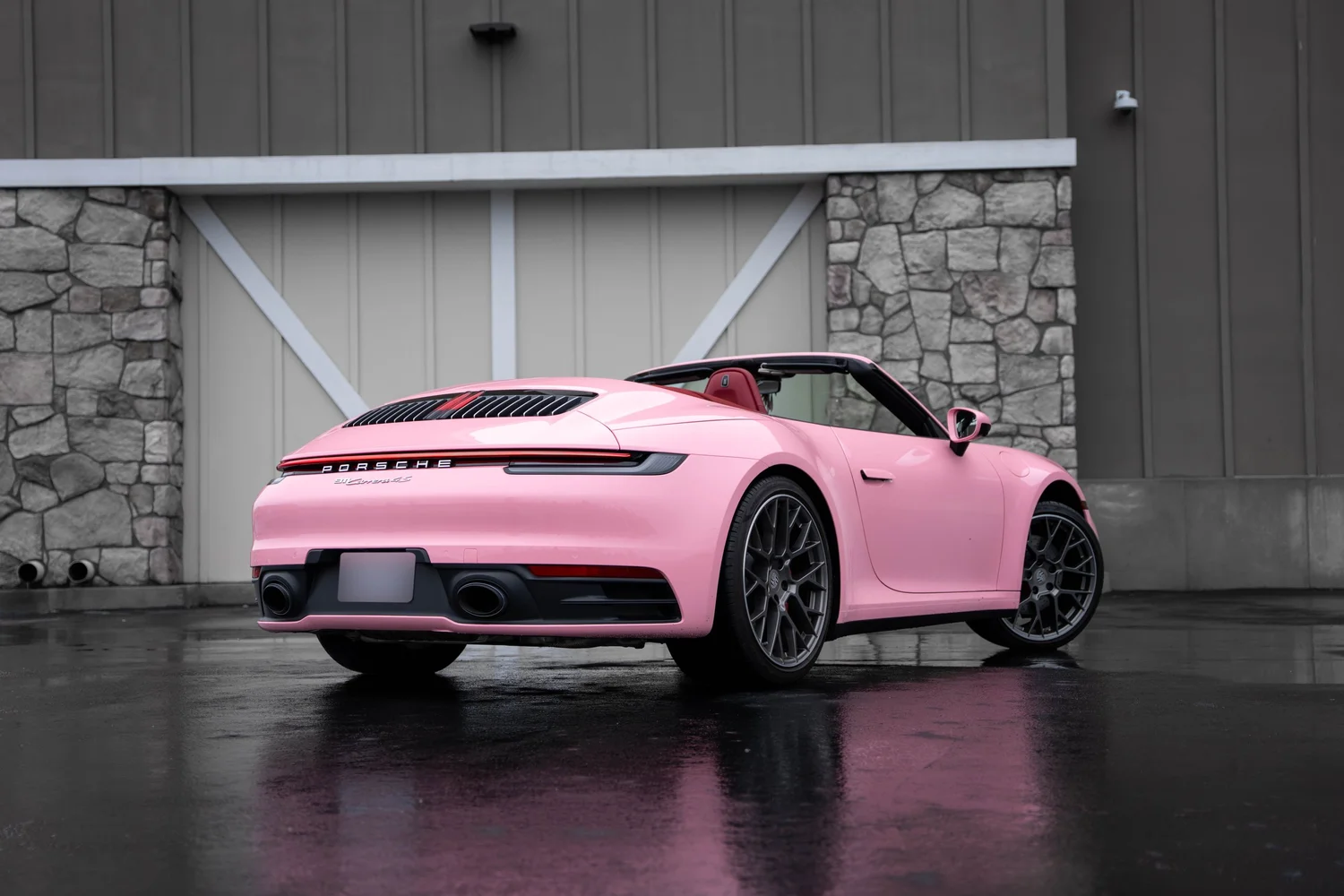 Porsche 911 Sakura Pink after Vinyl Wrap, rear-left three-quarter view
