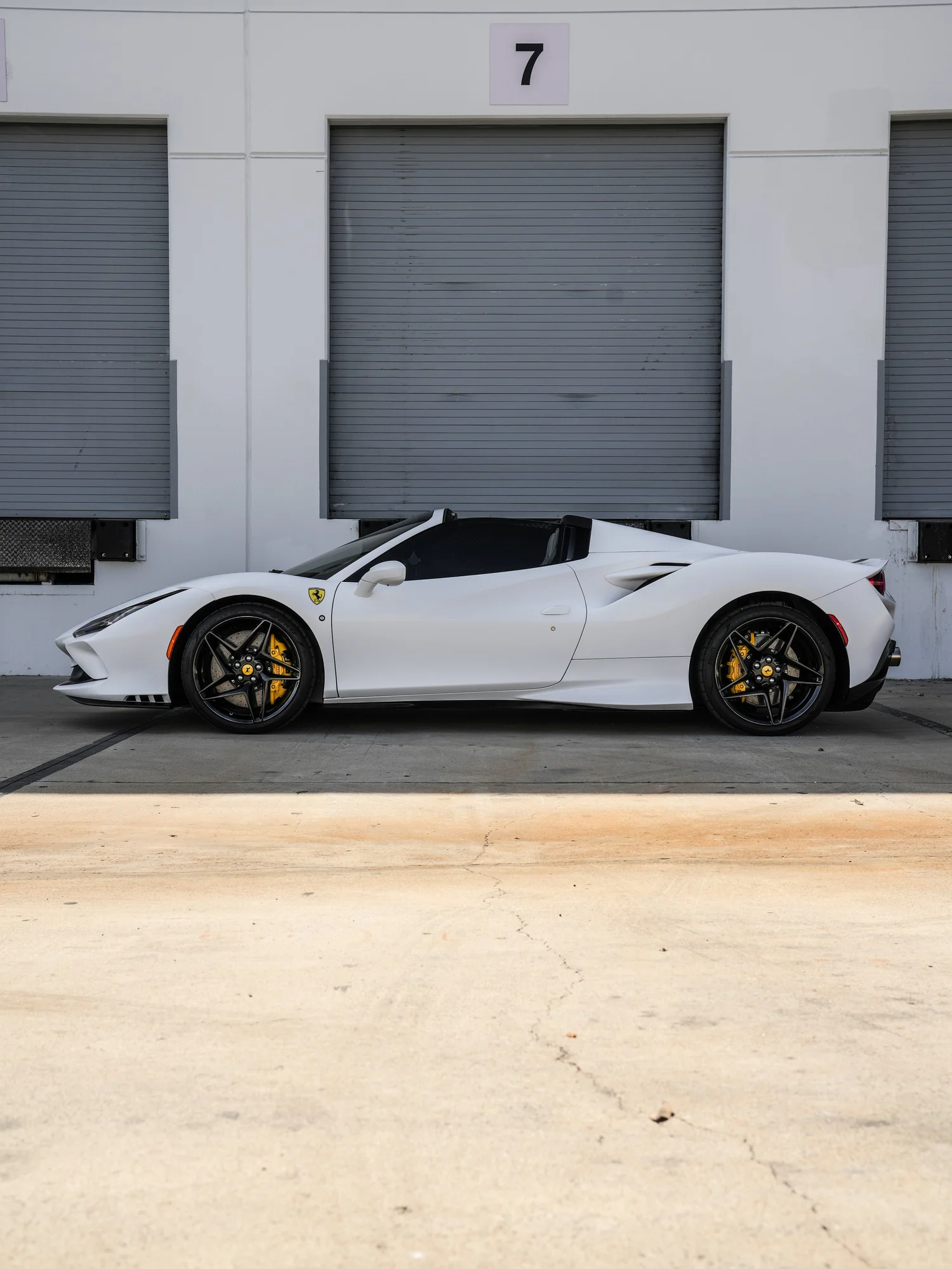 Ferrari F8 Spider after Matte PPF and Window Tint, full vehicle with open doors