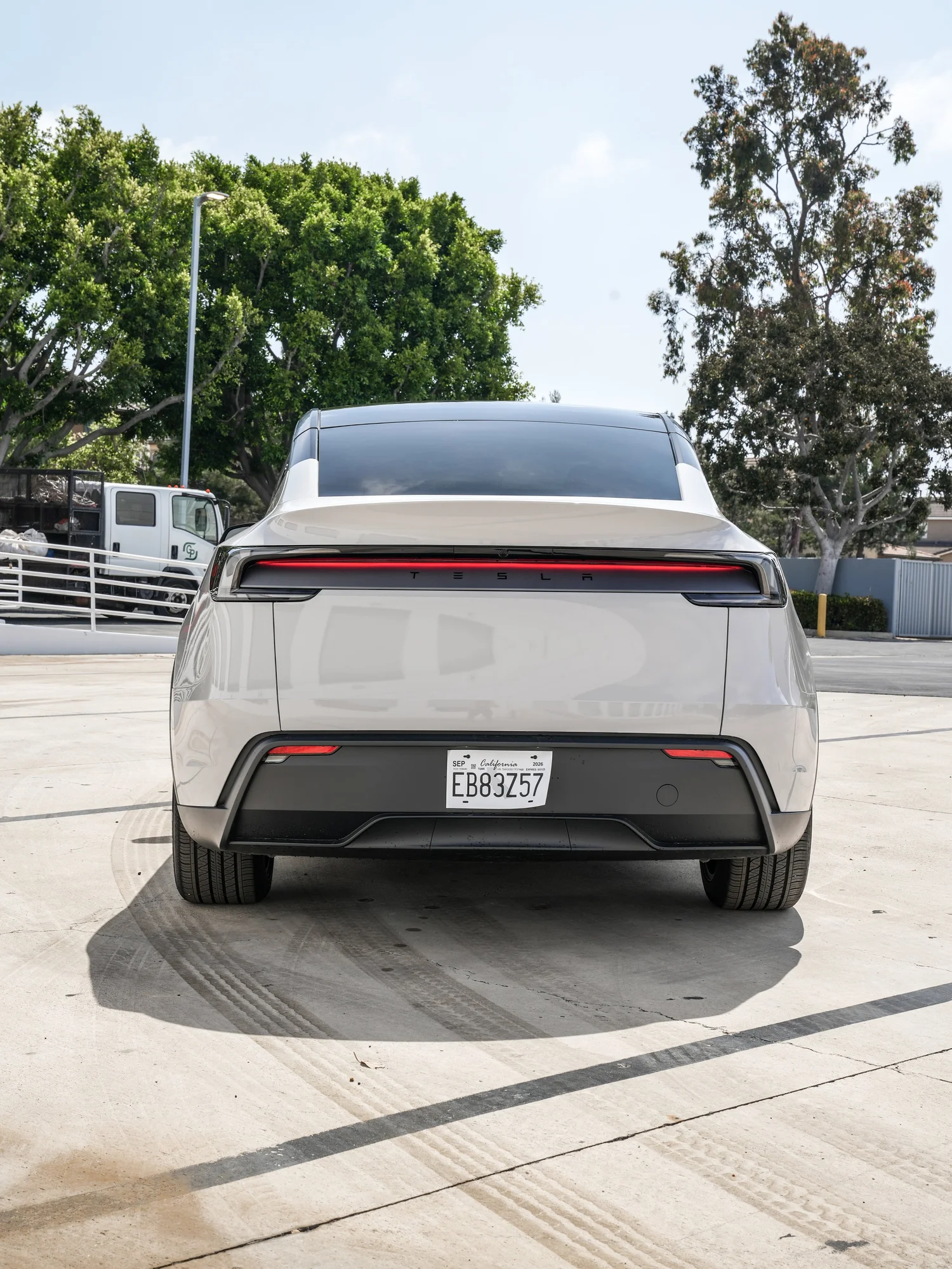 Tesla Model Y Chalk Grey Wrap after Vinyl Wrap, rear-right three-quarter view