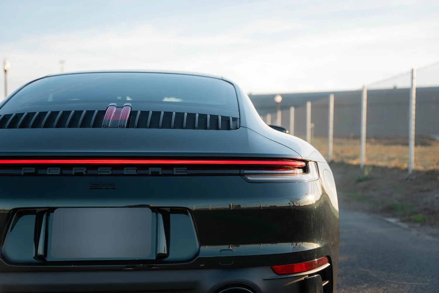 Porsche 911 Carrera Wrapped in British Green after Vinyl Wrap, rear body and taillight view