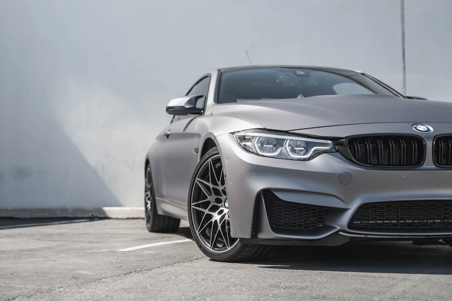 BMW M4 Matte Grey after Vinyl Wrap, front wheel and body view