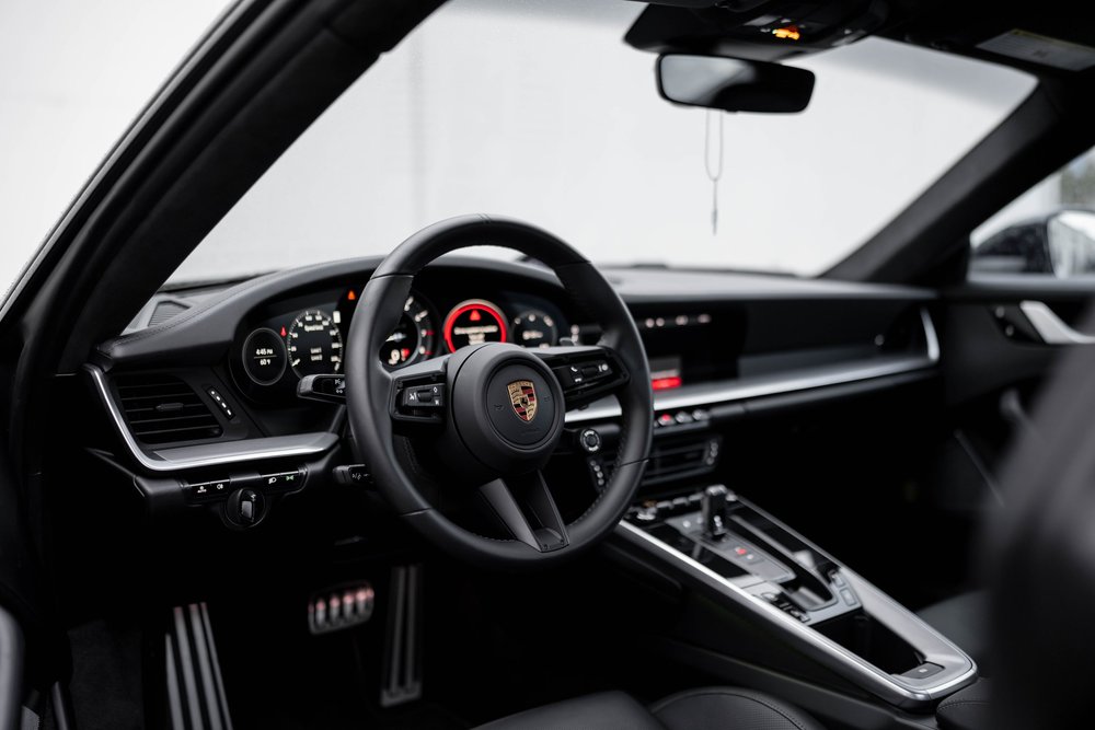 Porsche 911 Turbo S cockpit with steering wheel, instrument cluster and center console