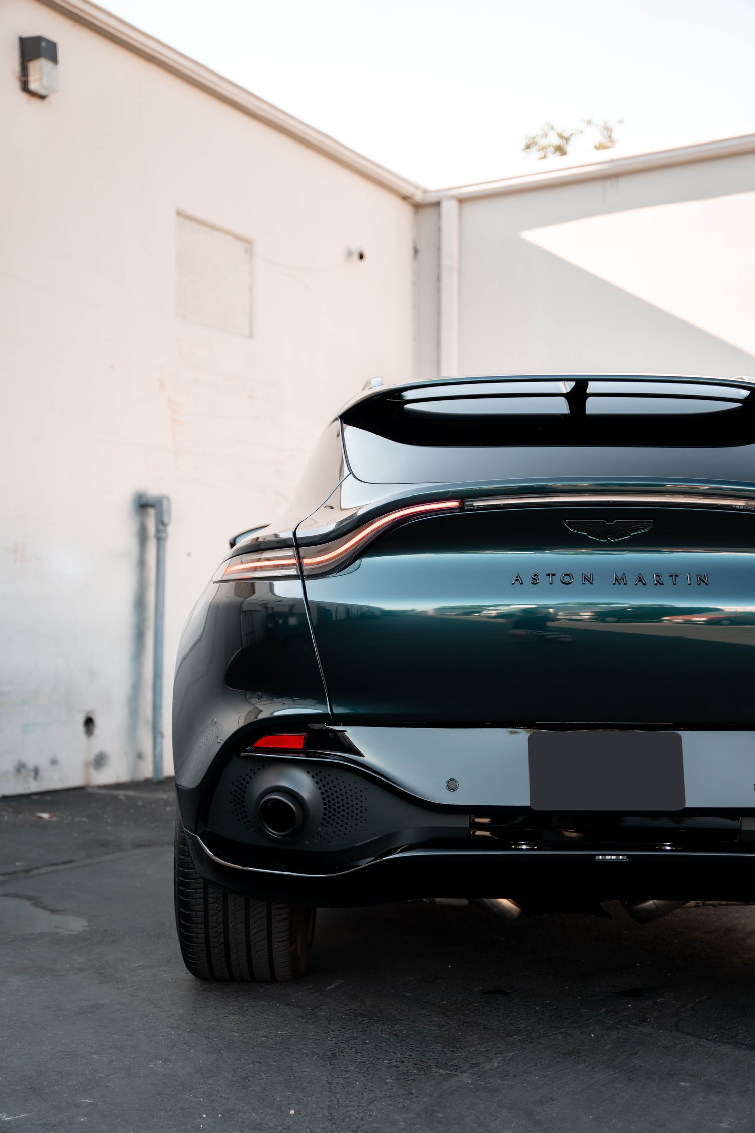 Aston Martin DBX after Paint Protection Film (PPF), Window Tint and Ceramic Coating, low-angle rear view