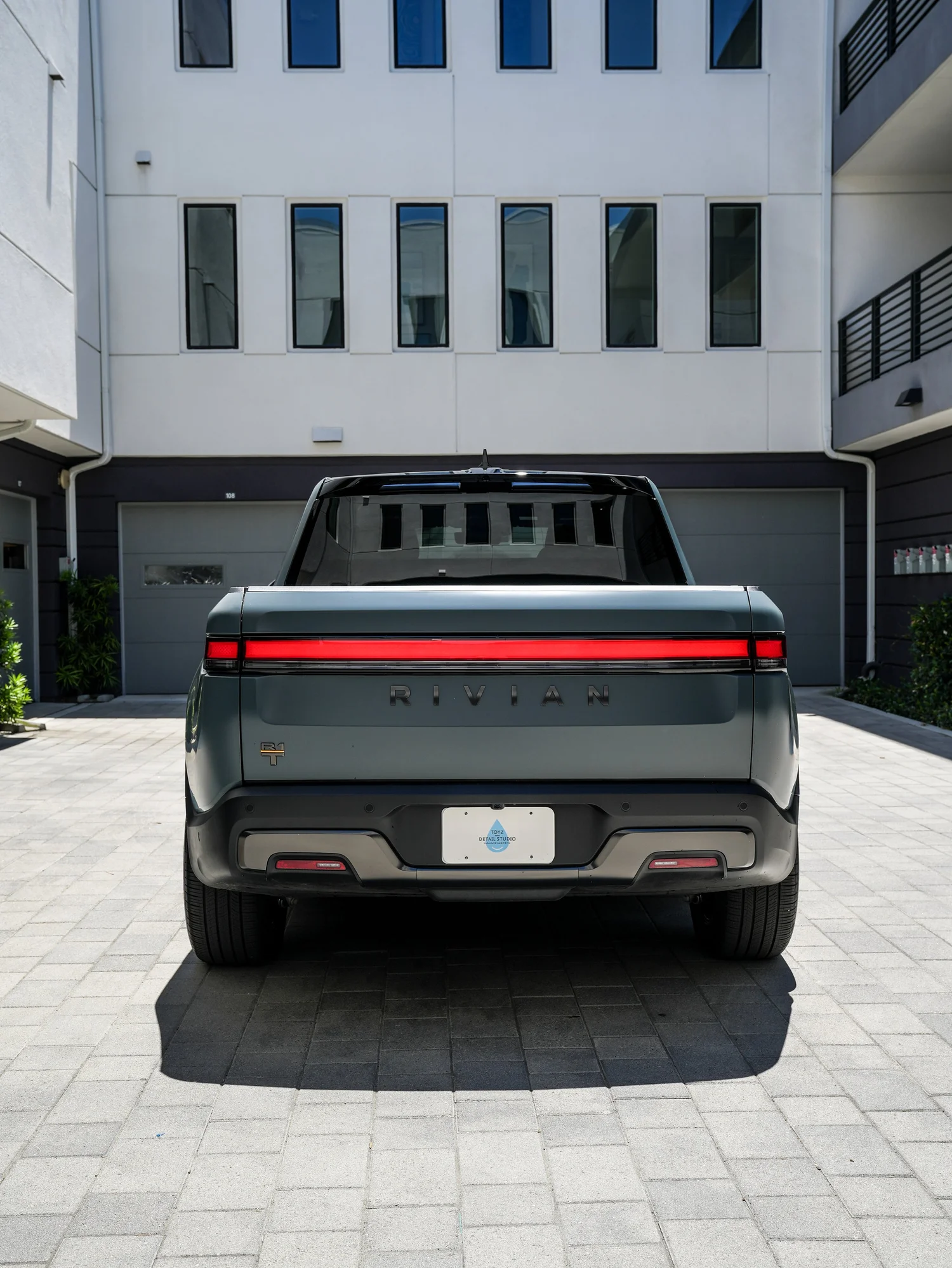 Rivian R1T after Matte PPF and Window Tint, rear body and taillight view