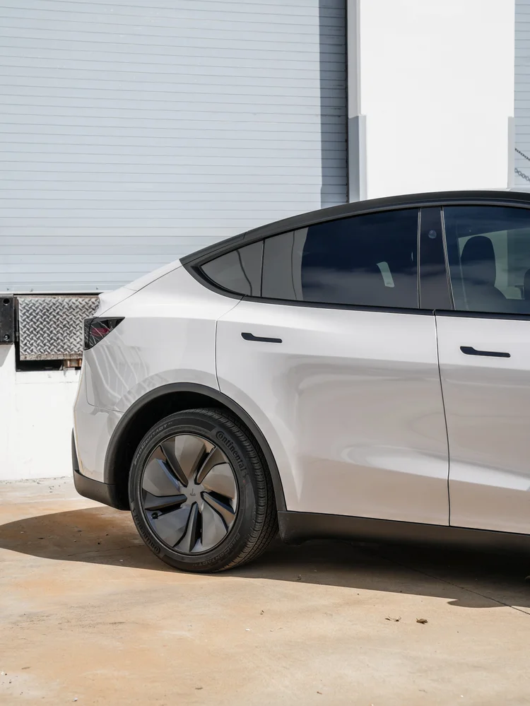 Chalk Grey Model Y rear wheel and door detail