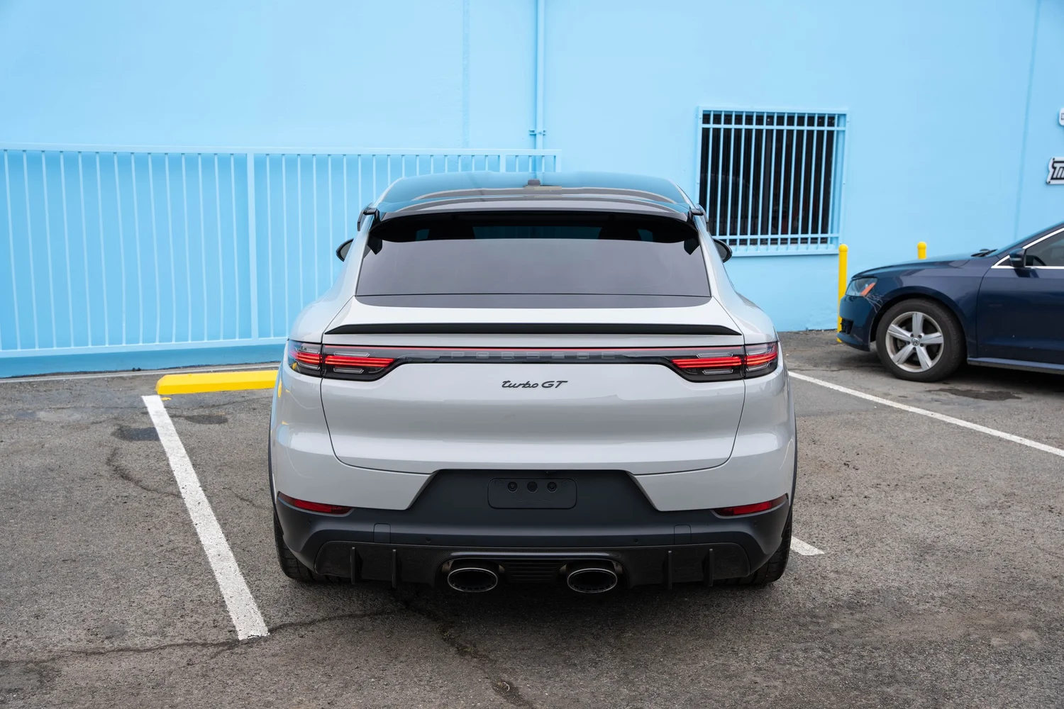 Porsche Cayenne Turbo GT centered rear view with quad exhaust outlets after PPF, window tint and ceramic coating