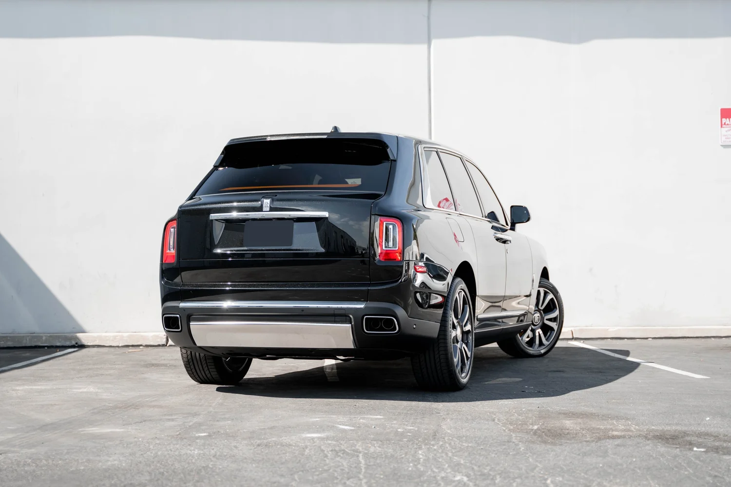 Black Rolls-Royce Cullinan with Chrome Exterior Trim after Paint Protection Film (PPF), Window Tint and Ceramic Coating, rear-right three-quarter view