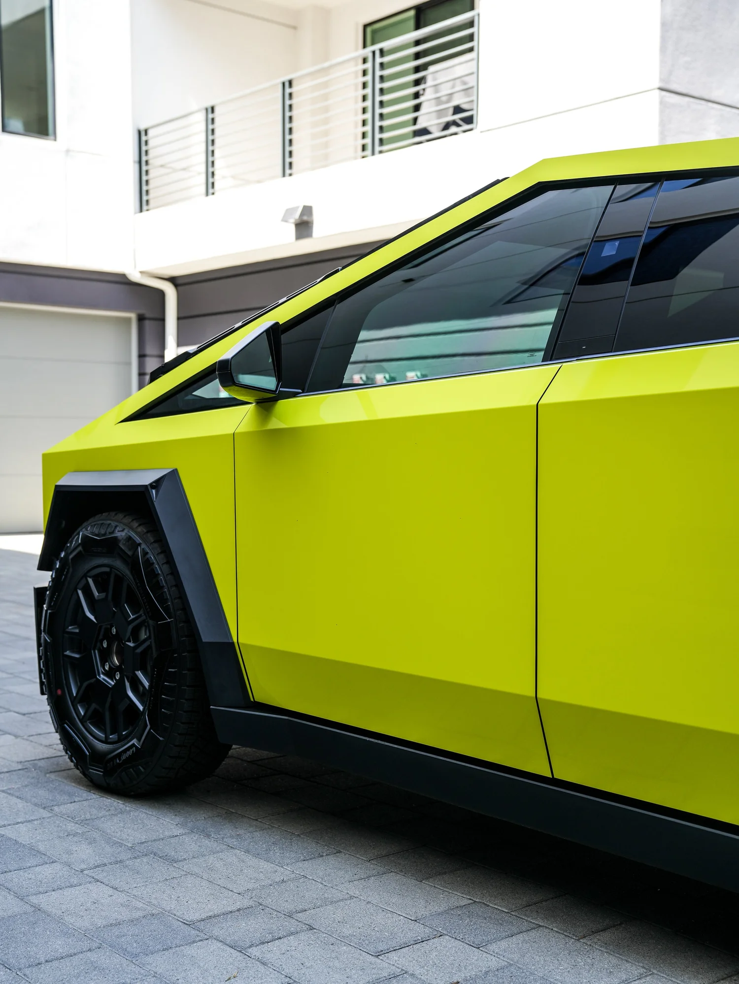 Tesla Cybertruck Inozetek Racing Yellow after Window Tint and Vinyl Wrap, side body-panel and door detail
