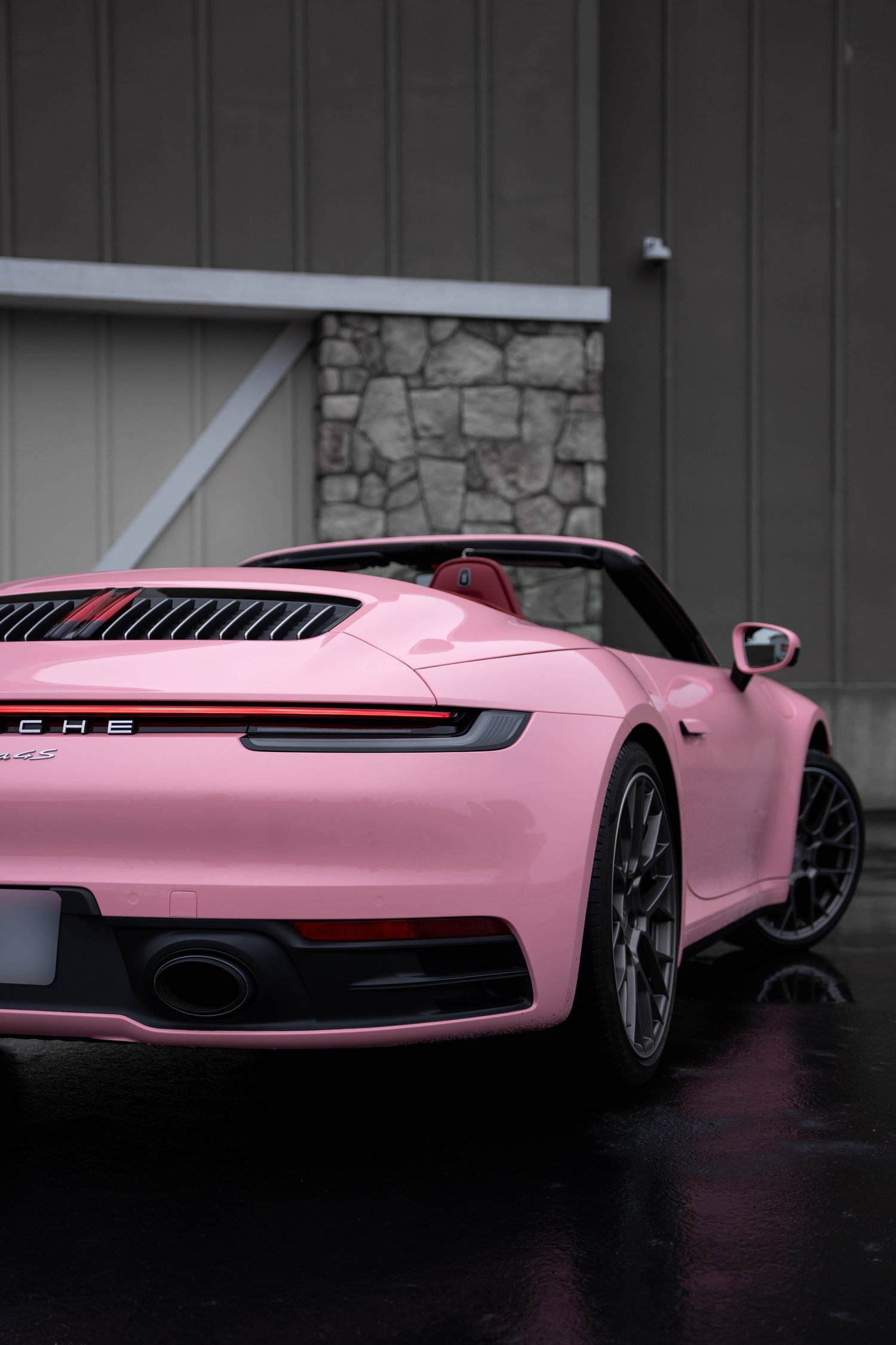 Porsche 911 Sakura Pink after Vinyl Wrap, wide rear three-quarter view