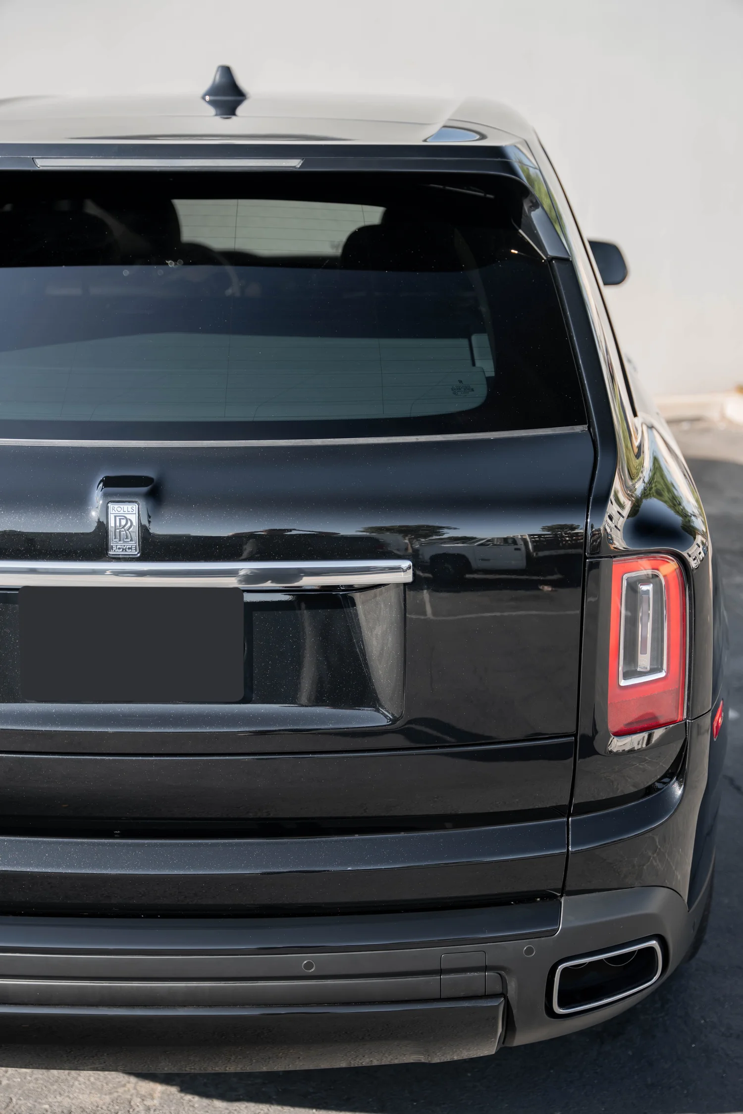 Dark Metallic Grey Rolls-Royce Cullinan after Paint Protection Film (PPF), Window Tint and Ceramic Coating, close rear view