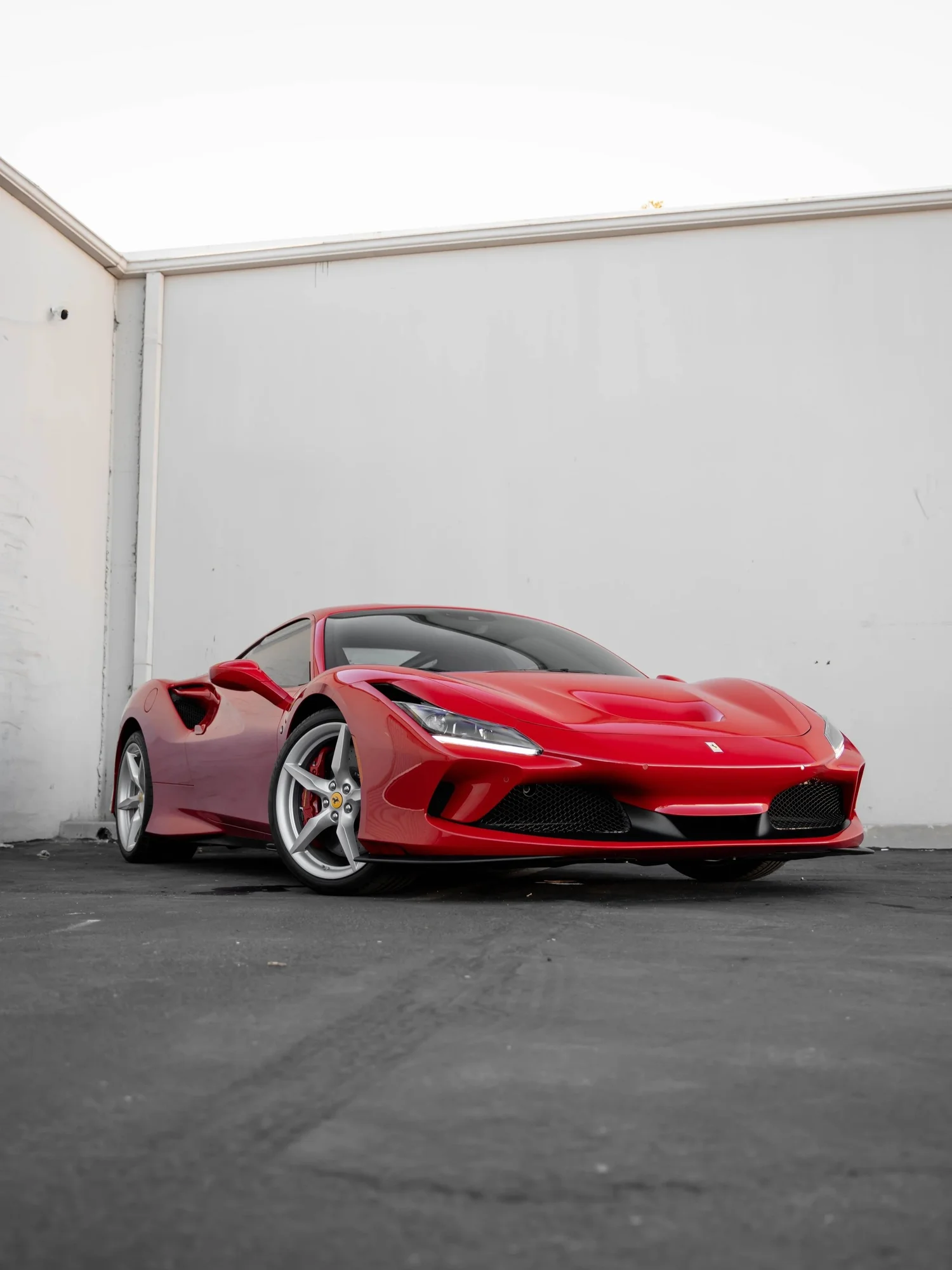 Rosso Corsa Ferrari F8 after Paint Protection Film (PPF), Window Tint and Ceramic Coating, front-right three-quarter view