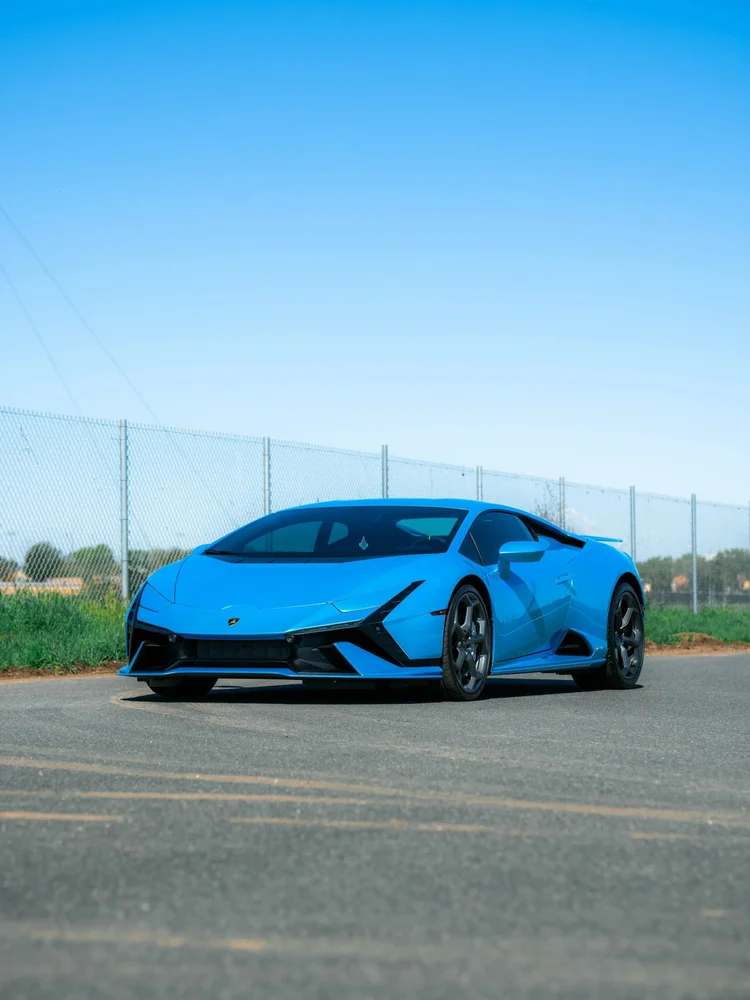 Blue Lamborghini Huracán Tecnica in a complete front-three-quarter view with dark wheels and black lower bodywork