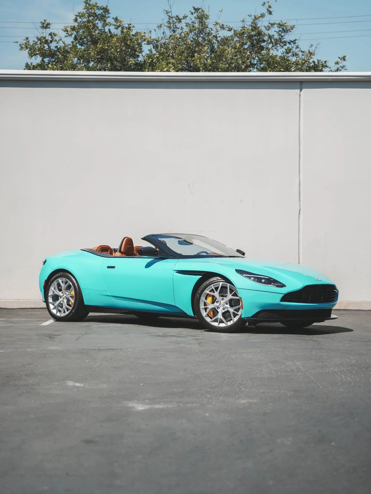 Aston Martin DB11 Miami Blue after Vinyl Wrap, front-left three-quarter view