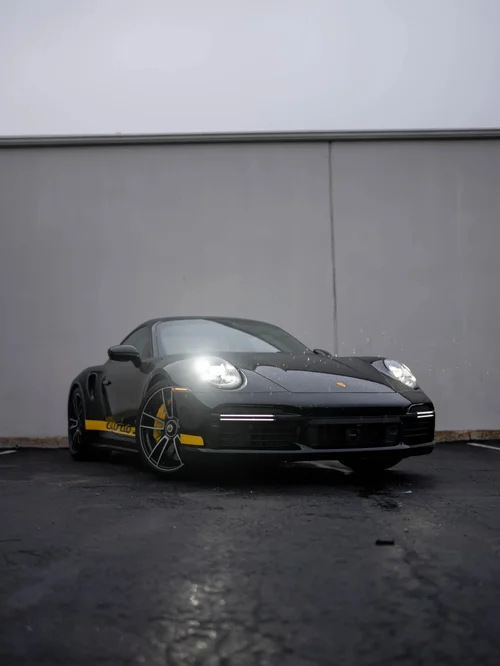 Black Porsche 911 Turbo S with Yellow Turbo S Decal PPF, Window Tint & Ceramic Coating