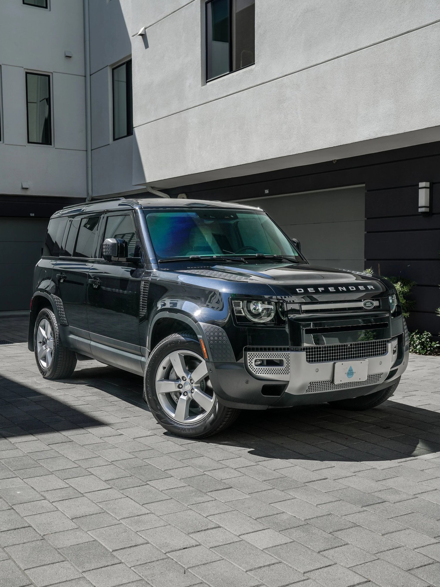 Land Rover Defender after Paint Protection Film (PPF) and Window Tint, front-left three-quarter view