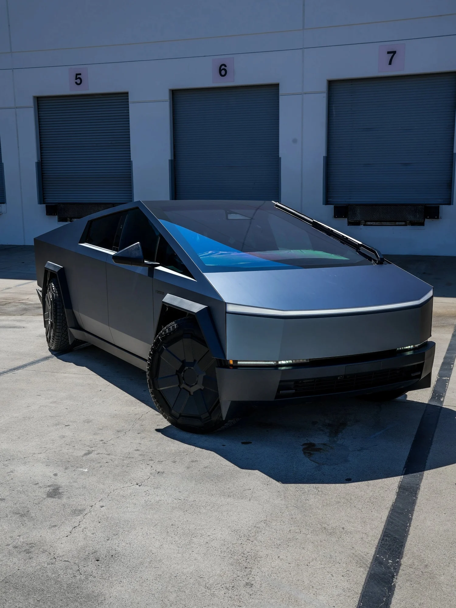 Tesla Cybertruck Ghost Metal Grey Blue after Window Tint and Vinyl Wrap, front-left three-quarter view