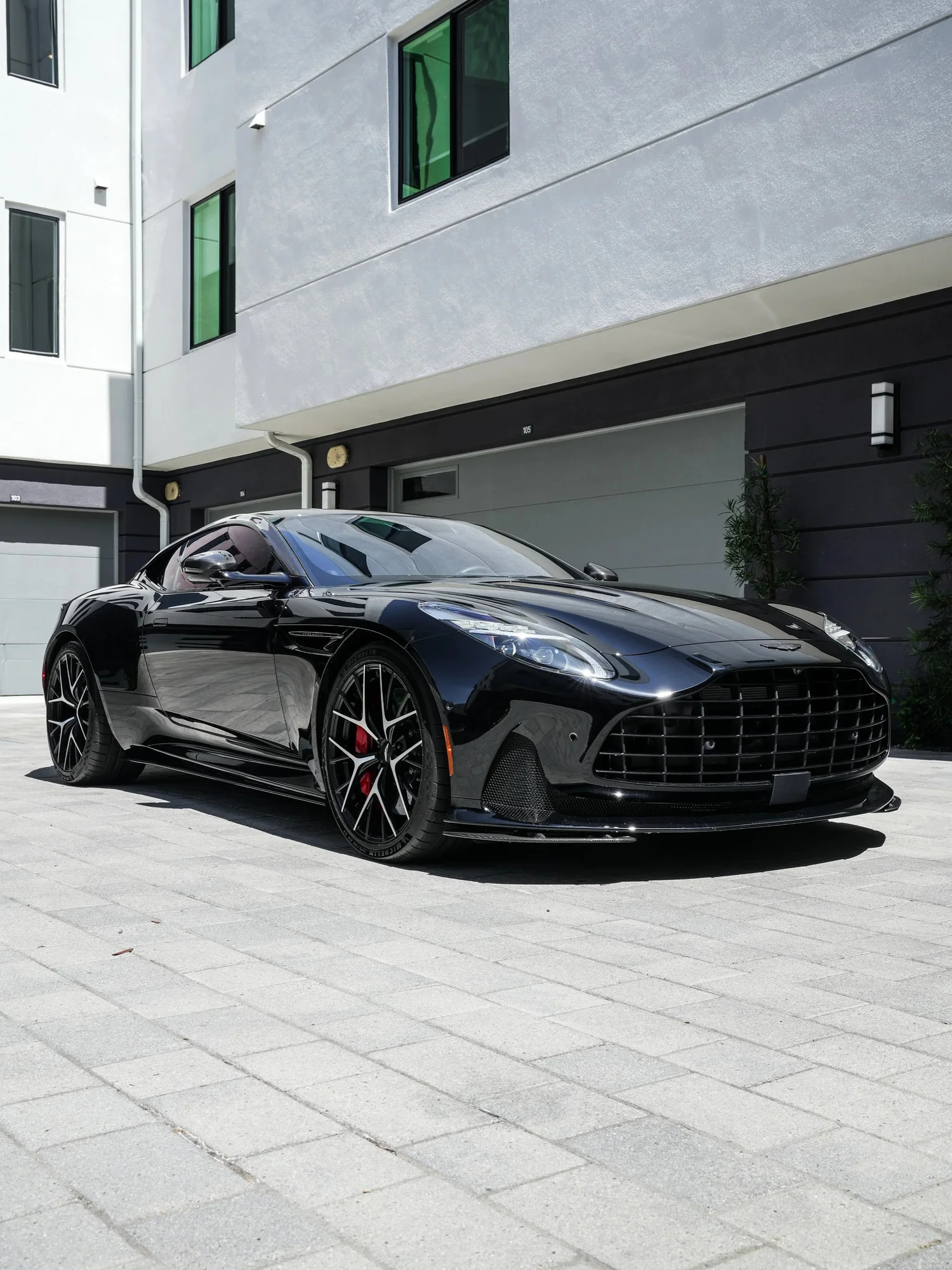 Aston Martin DB12 front three-quarter view from the driver side after full exterior PPF, window tint and ceramic coating